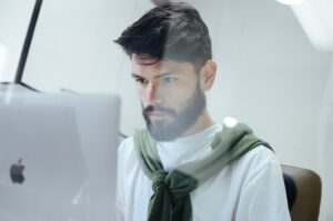 An artificial intelligence developer working behind a computer